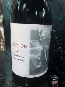 2015 Pinot Noir bottle with label of 1940's woman and man